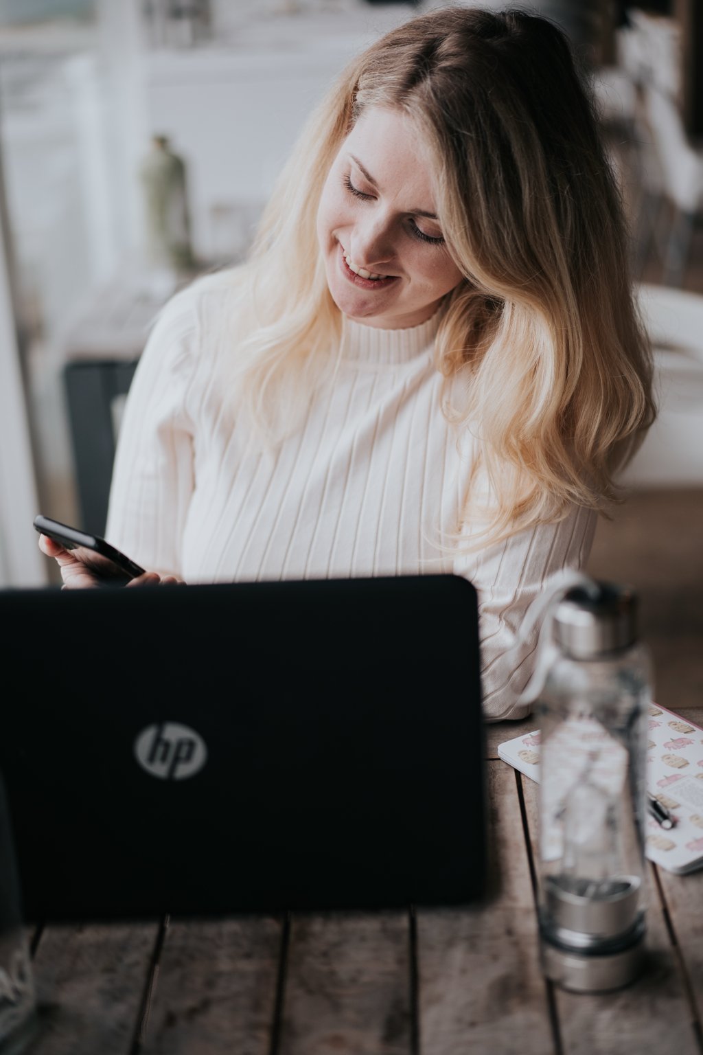 Charlotte Kroon smiling at her desk